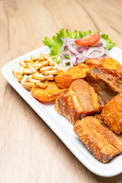 Peruvian chicharron plate with sweet potato and canchita