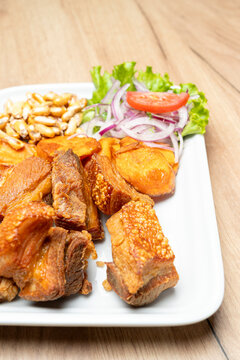Peruvian chicharron plate with sweet potato and canchita