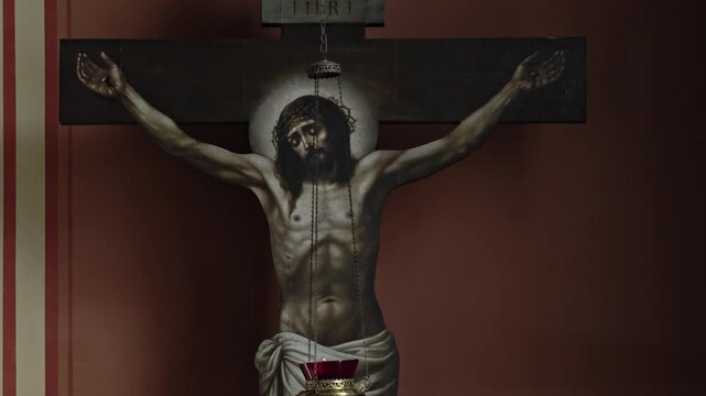 Russia, St. Petersburg, August 8, 2020 Christian symbol, red wall, Jesus on cross, faith, spirituality, devotion