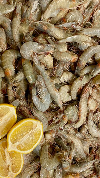 Raw fresh shrimp and lemon ready for cooking
