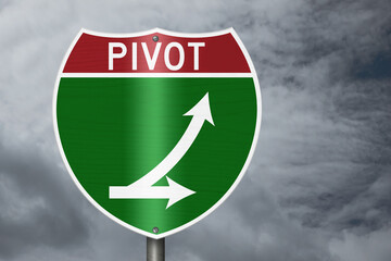 Pivot with arrows on an American interstate road sign with stormy sky for next steps © Karen Roach