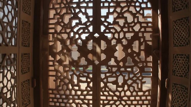 Mashrabiya shadows shifting slowly