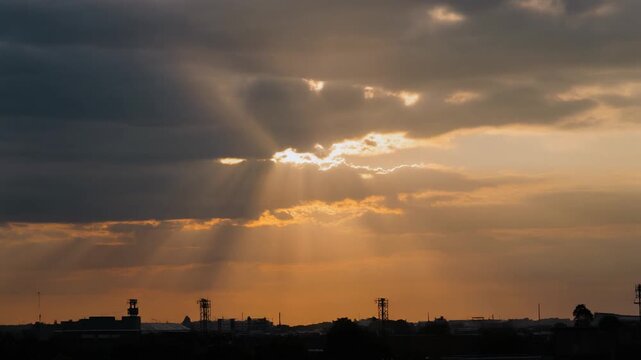 Rays fanning from a cloud at sunset