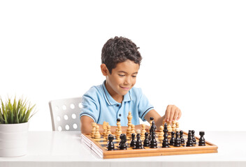 Young boy smiling and playing a game of chess © Ljupco Smokovski