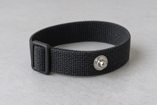 Unbranded antistatic wristband with metal snap on a preparation bench