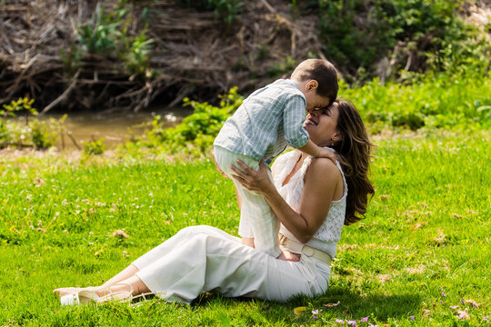 Mother and son bonding outdoors sharing affection