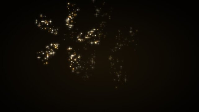 Sparkling snowflake effect in motion from start to finish with glowing particles on dark background