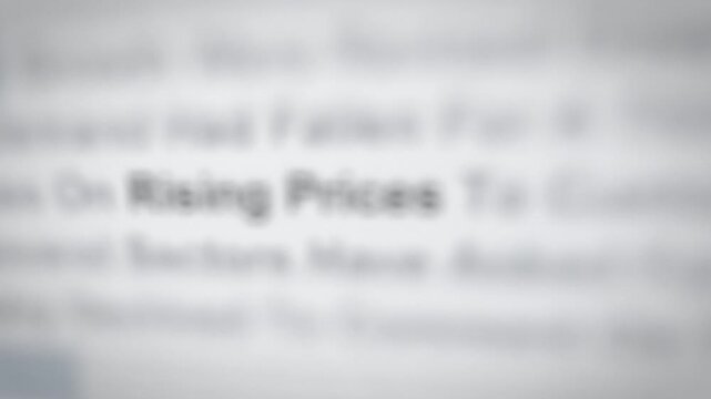 Seamless loop rising prices word in news articles focus montage
