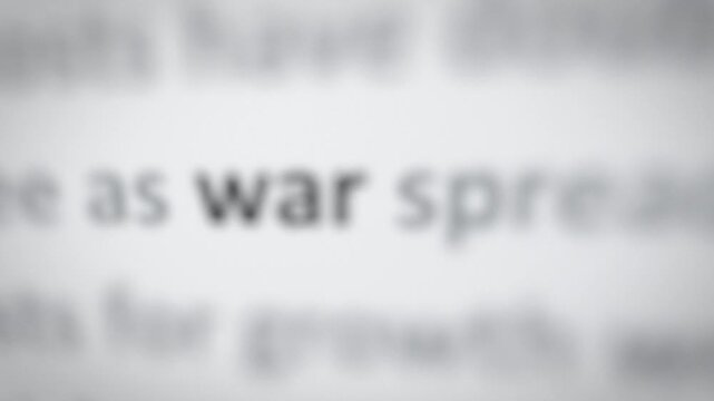 Seamless loop war word in news articles focus montage