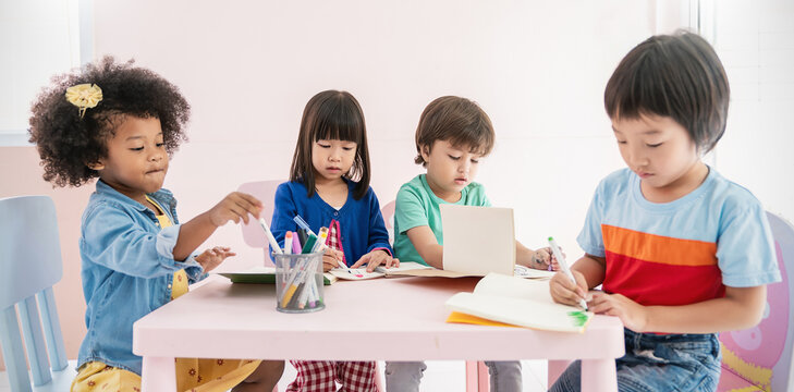 Group of pupil boy girl toddler group study in classroom at nursery pre school. Student in primary school writing drawing. Children classroom. Education knowledge, success teamwork banner