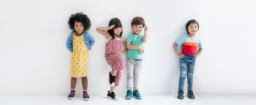 Portrait of happy diverse children stand in row white background. Friendship childhood diversity and together. Nursery day care Home school education diversity multicultural community back to school