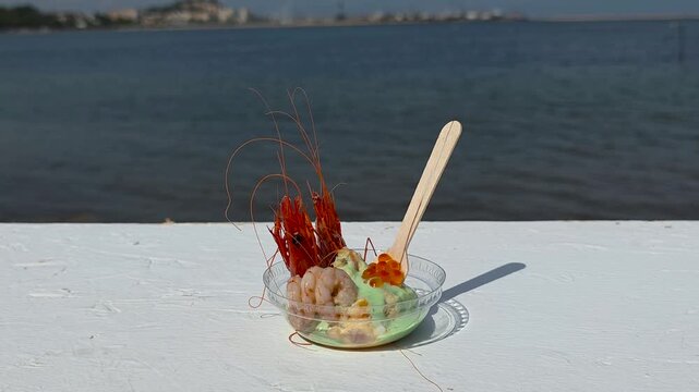 Creative artisanal dish featuring Red Denia Prawn (Gamba Roja de D&eacute;nia) heads and tails, smooth avocado cream, and salmon caviar overlooking the Mediterranean Sea at a gastronomic festival