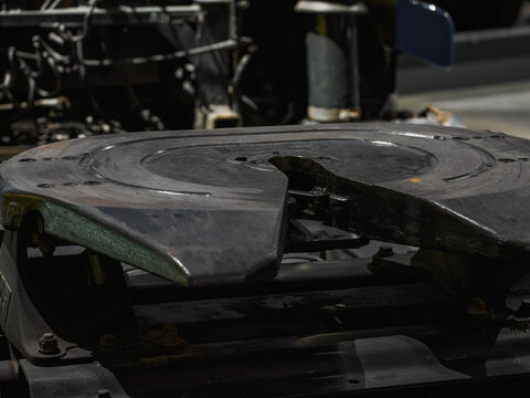 Detail of the fifth wheel coupling ramp on a semi-truck tractor.