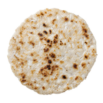 Sri Lankan pol roti, thick rustic coconut flatbread with browned gridd Isolated on White Background