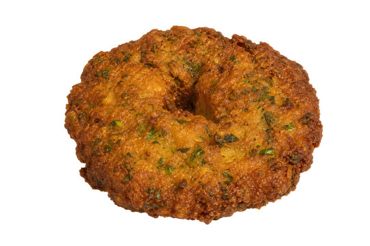 Surinamese bara, flat ring-shaped split-pea fritter with green herb Isolated on White Background