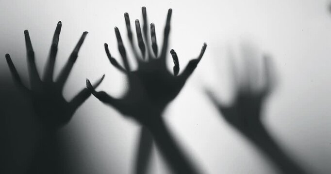 Shadow of a zombie hand on white background

