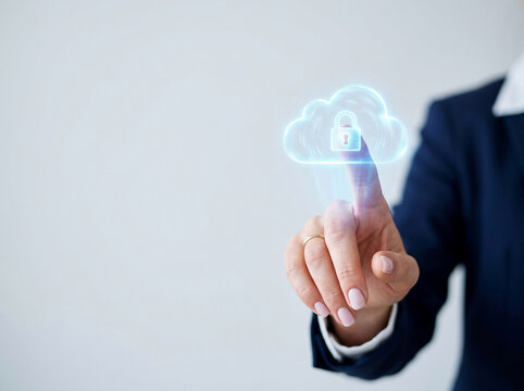 Businesswoman hand touching cloud storage icon with padlock representing secure database, cloud computing, and cyber security protection