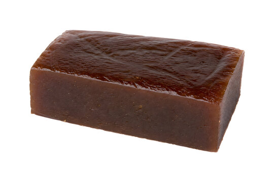 Southeast Asian dodol dense dark-brown sweet block with glossy chewy Isolated on White Background