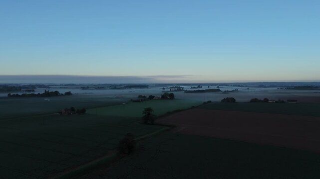 Dawn's soft glow paints the countryside