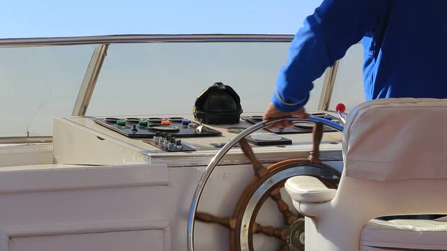 Captain steering boat in Egypt