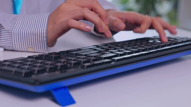 Computer Keyboard Typing by Human Hand at Office Workplace Desk, Showing Focused Technology Work, Digital Communication, Professional Productivity, and Modern Business Activity with Blue Accents