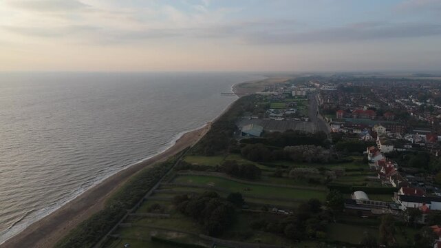 Golden hour bathes the coastline in soft light