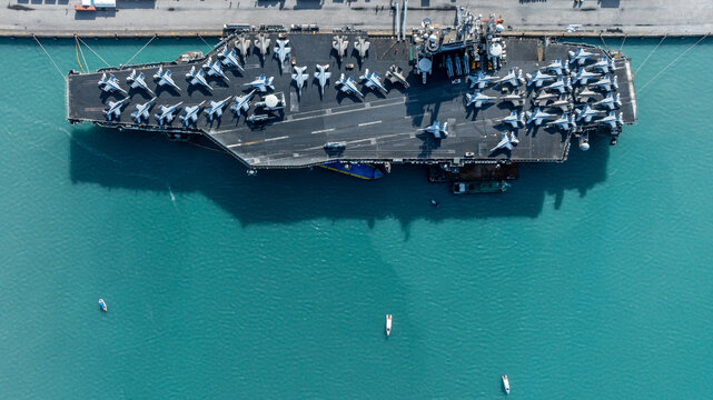 Aerial view nuclear powered aircraft carrier, USA navy ship carrier airplane fighter jet aircraft army navy nuclear ship carrier full fighter jet aircraft technology of battleship.