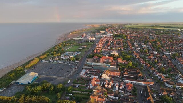 Warm sunset lights glow over coastal town