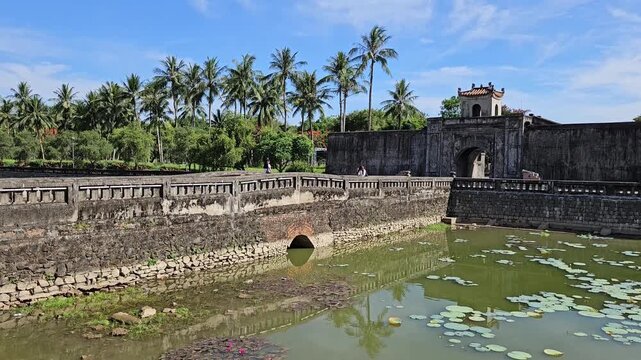 Vertical panning shot of Quang Tri Ancient Citadel gate and stone moat bridge in Quang Tri, Vietnam.