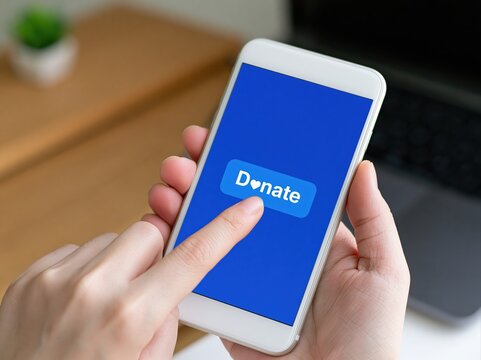 Donate online using a smartphone for charity fundraising and digital support for philanthropy