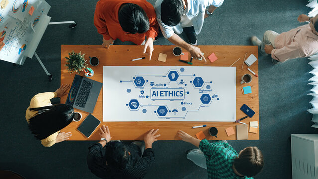 A diverse group collaborates to discuss AI ethics around a table, engaging in brainstorming and strategy development to navigate the complexities of technology responsibly. Amity