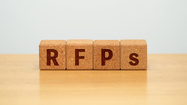 RFPs on four cork wooden blocks - requests for proposal concept