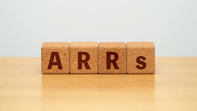 ARRs on four cork wooden blocks - annual recurring revenue concept