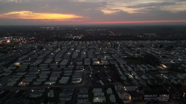 Sunset dims sky above vast mobile home park