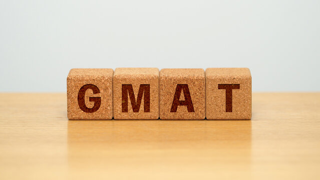 GMAT on four cork wooden blocks - Graduate Management Admission Test concept