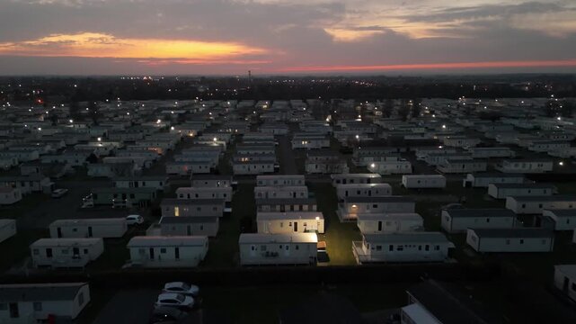 Aerial view of a large mobile home park at dusk
