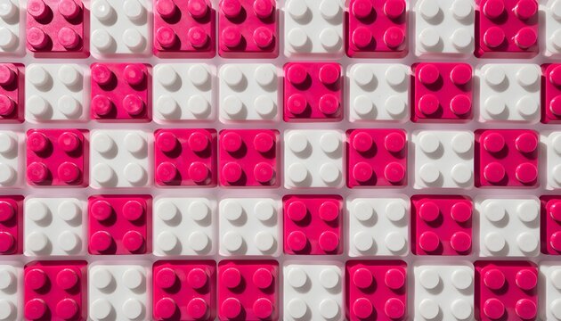 Hot pink and white plastic building blocks in a grid pattern