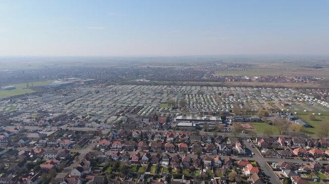 Aerial view of suburban neighborhood under clear sky