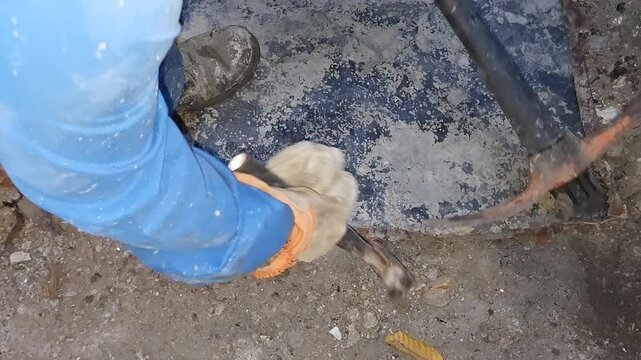 Sheet Metal Worker Bending Edges With Hammer