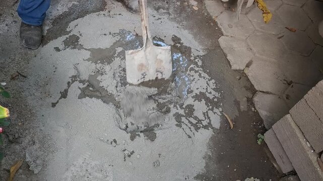 Shovel Mixing Wet Cement Mortar And Sand With Water