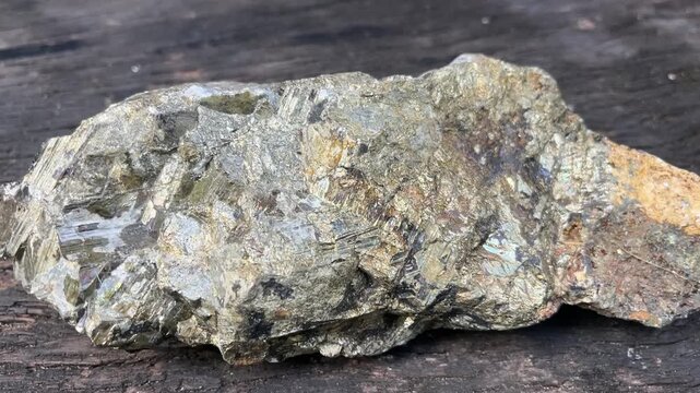 Rough Stone Texture: A close-up shot reveals the intricate details and rough texture of a weathered stone, showcasing its natural beauty and earthy tones.