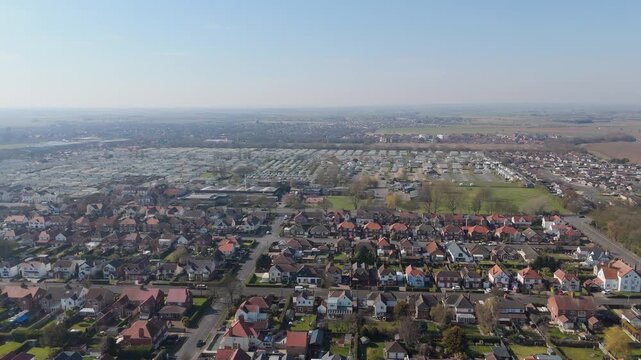 Aerial view of a suburban neighborhood under clear skies