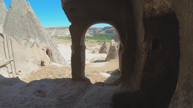 Cappadocia fairy chimneys and cave houses reveal passages inside carved volcanic rock.