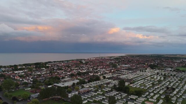 Aerial view over coastal town with caravans and houses