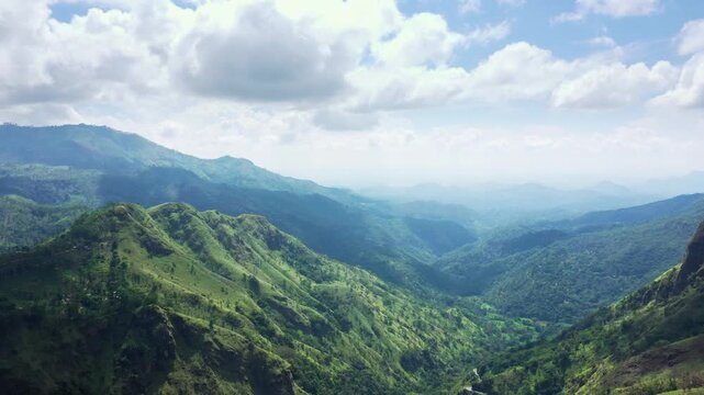 Aerial View of Lush Green Mountains and Winding Road in Sri Lanka