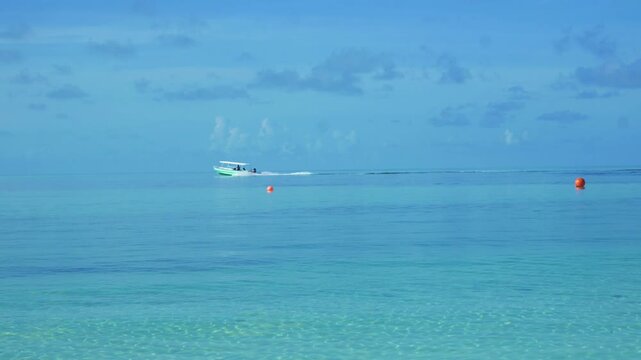 Small Motorboat Speeding Across Calm Turquoise Ocean Horizon