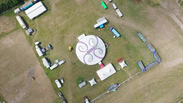 Aerial view of circular event space with swirl logo