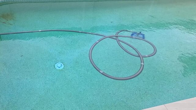 Time Lapse of Automatic Pool Cleaner Vacuuming Backyard Swimming Pool