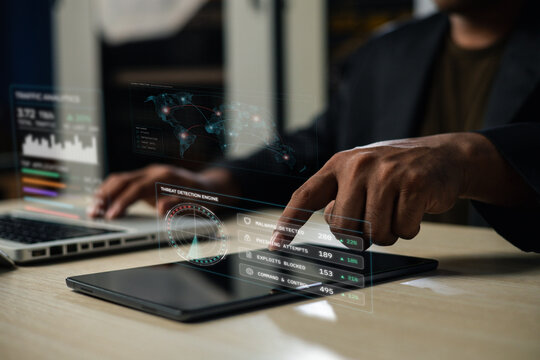 Cybersecurity analyst monitors malware, phishing and exploit threats on a digital security dashboard. The scene represents SOC monitoring, threat intelligence, cyber defense and incident response.