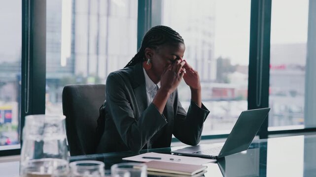 Black woman, stress and laptop in office for finance, banking mistake and incorrect transaction. Accountant, computer or headache in business for missing data, wrong information or tax audit deadline